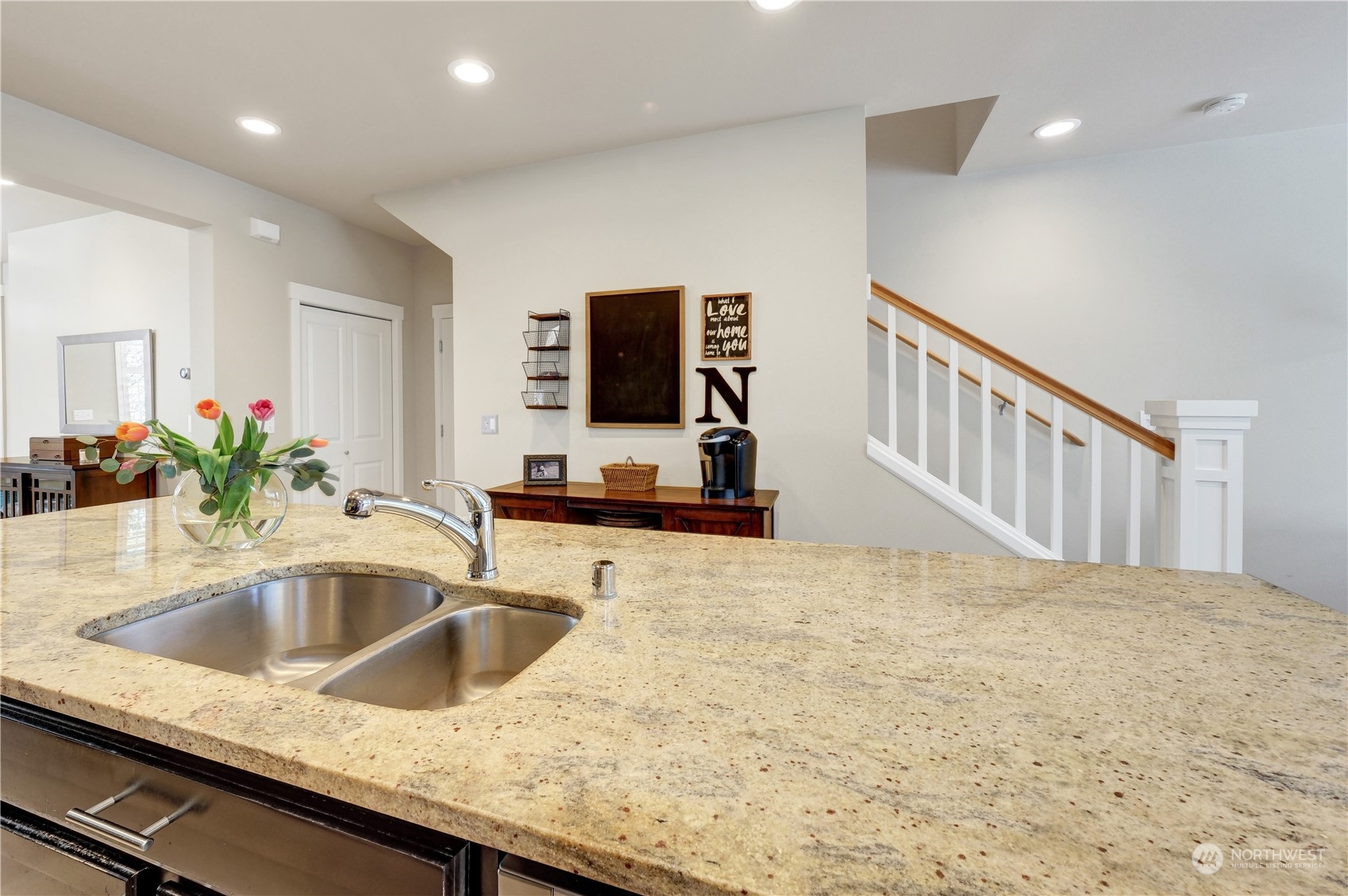 21907 37th Drive Southeast, Unit 30 Bothell, WA 98021 - Photo 14 of 27 a kitchen with granite countertop a sink and a stove top oven