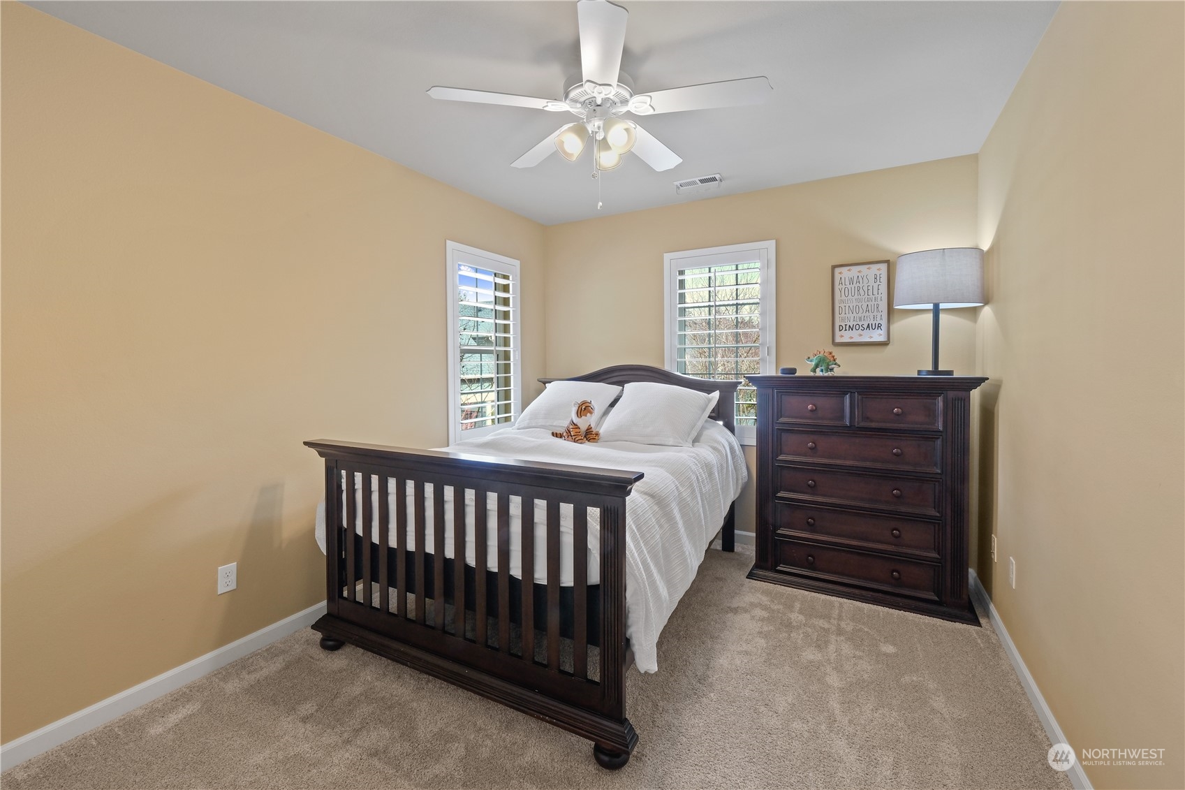 21907 37th Drive Southeast, Unit 30 Bothell, WA 98021 - Photo 17 of 27 a bedroom with a bed and a table
