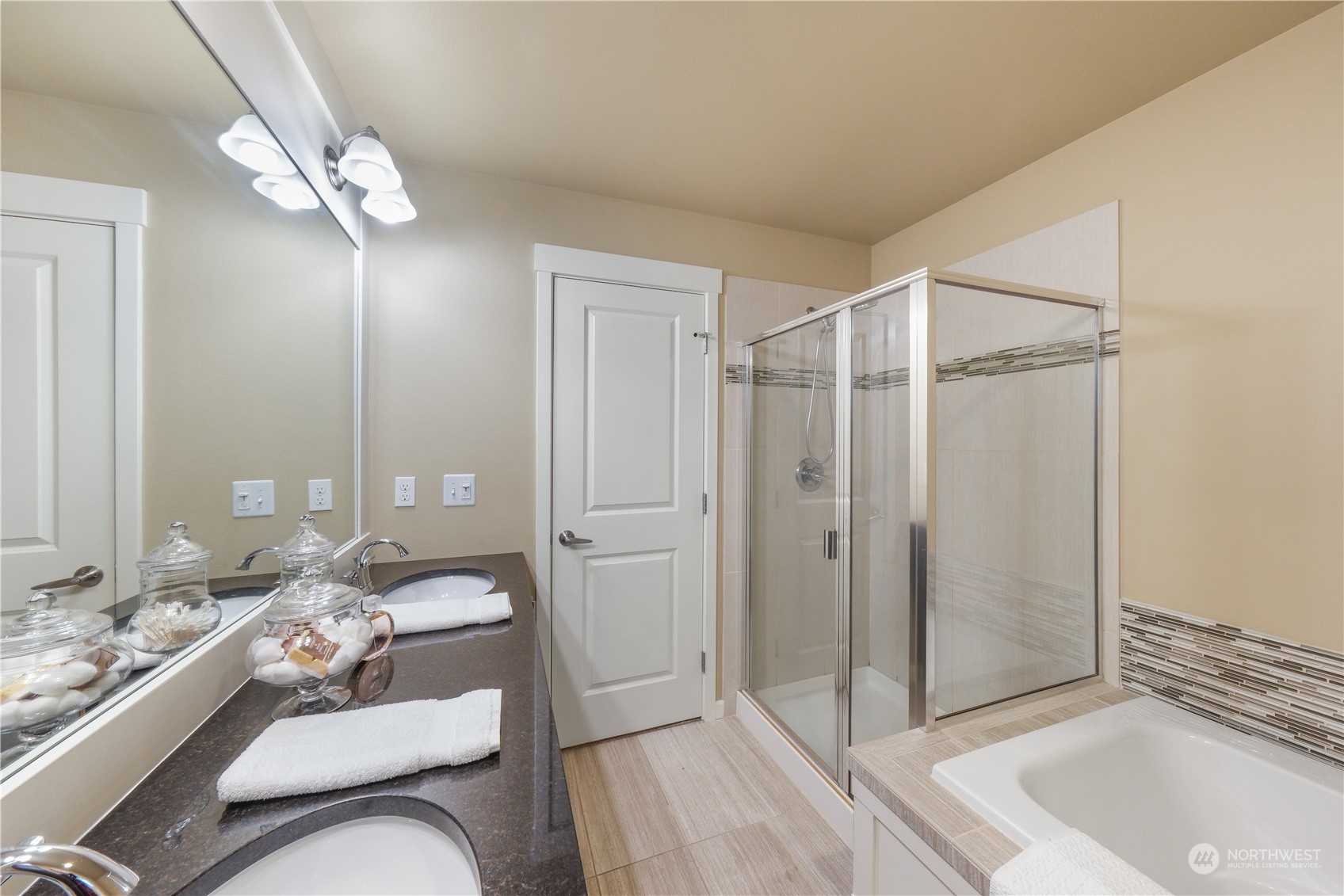 21907 37th Drive Southeast, Unit 30 Bothell, WA 98021 - Photo 21 of 27 a spacious bathroom with a double vanity sink and a mirror
