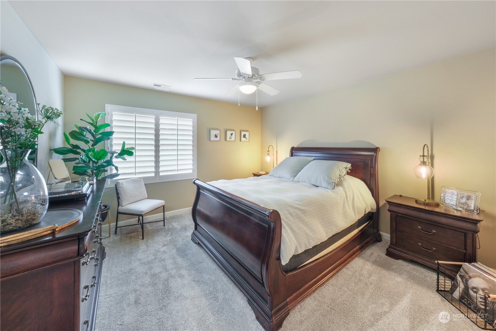 21907 37th Drive Southeast, Unit 30 Bothell, WA 98021 - Photo 22 of 27 a bedroom with a bed and a potted plant
