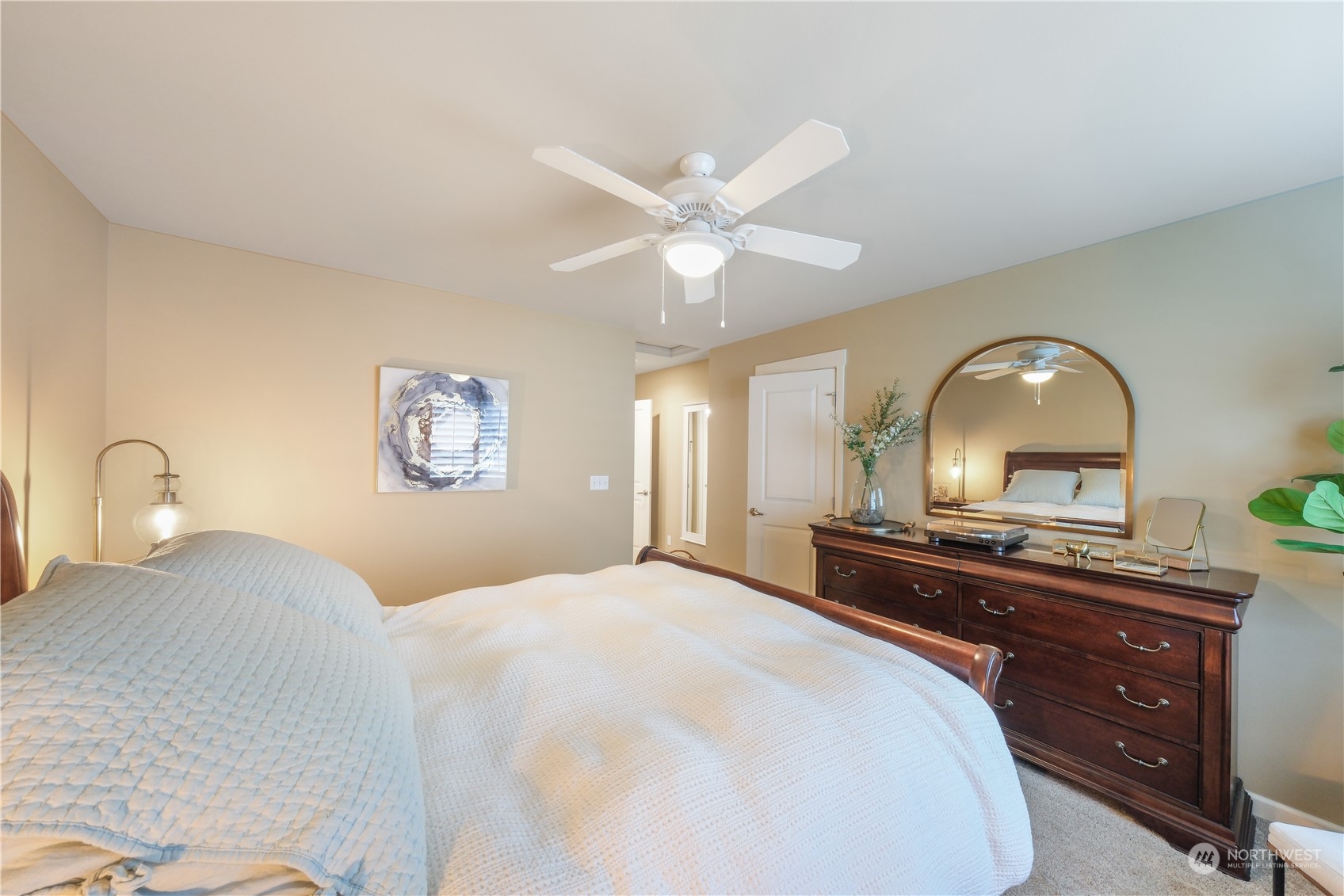 21907 37th Drive Southeast, Unit 30 Bothell, WA 98021 - Photo 23 of 27 a bedroom with a bed and a dresser with mirror