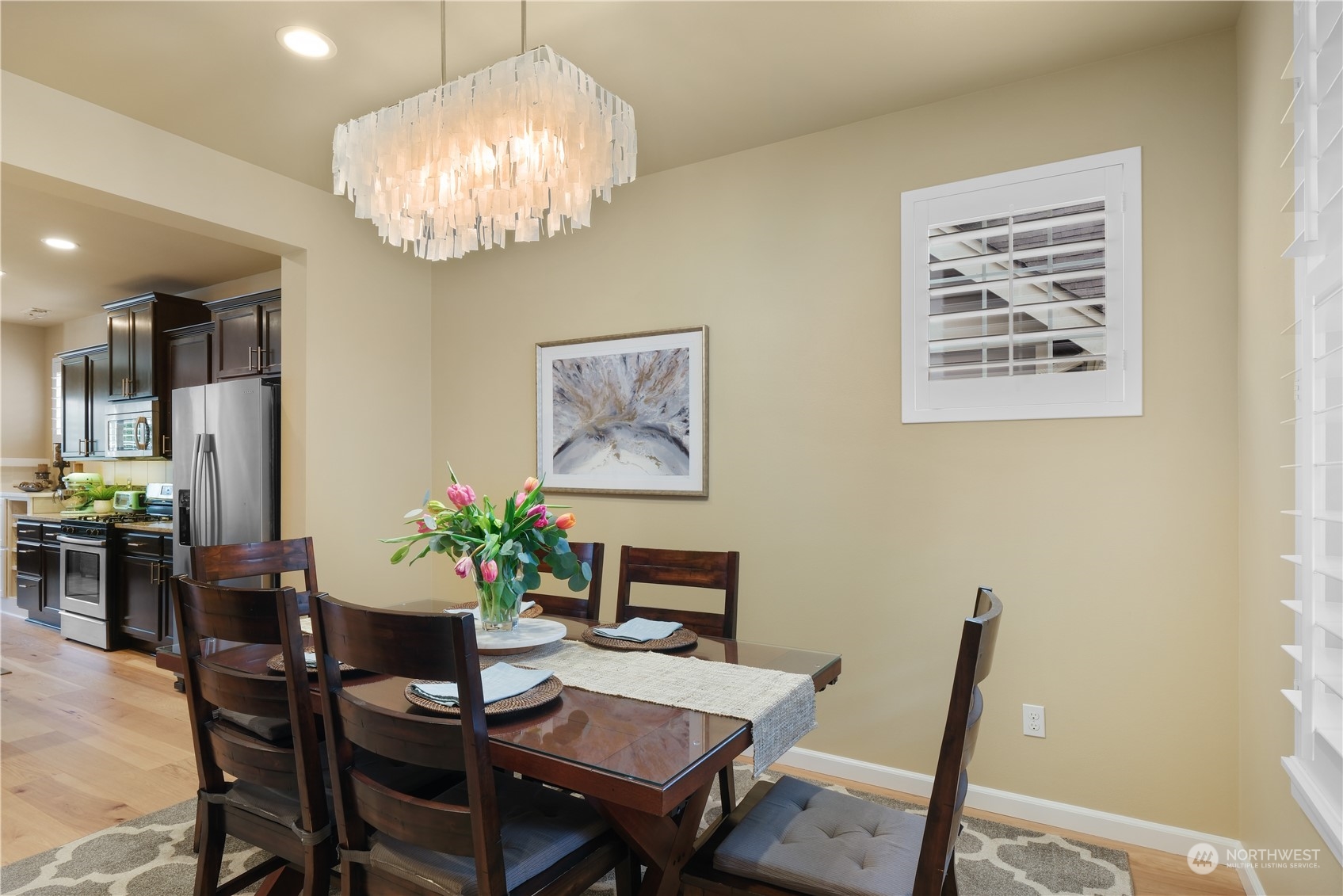 21907 37th Drive Southeast, Unit 30 Bothell, WA 98021 - Photo 4 of 27 a view of a dining room with furniture and chandelier