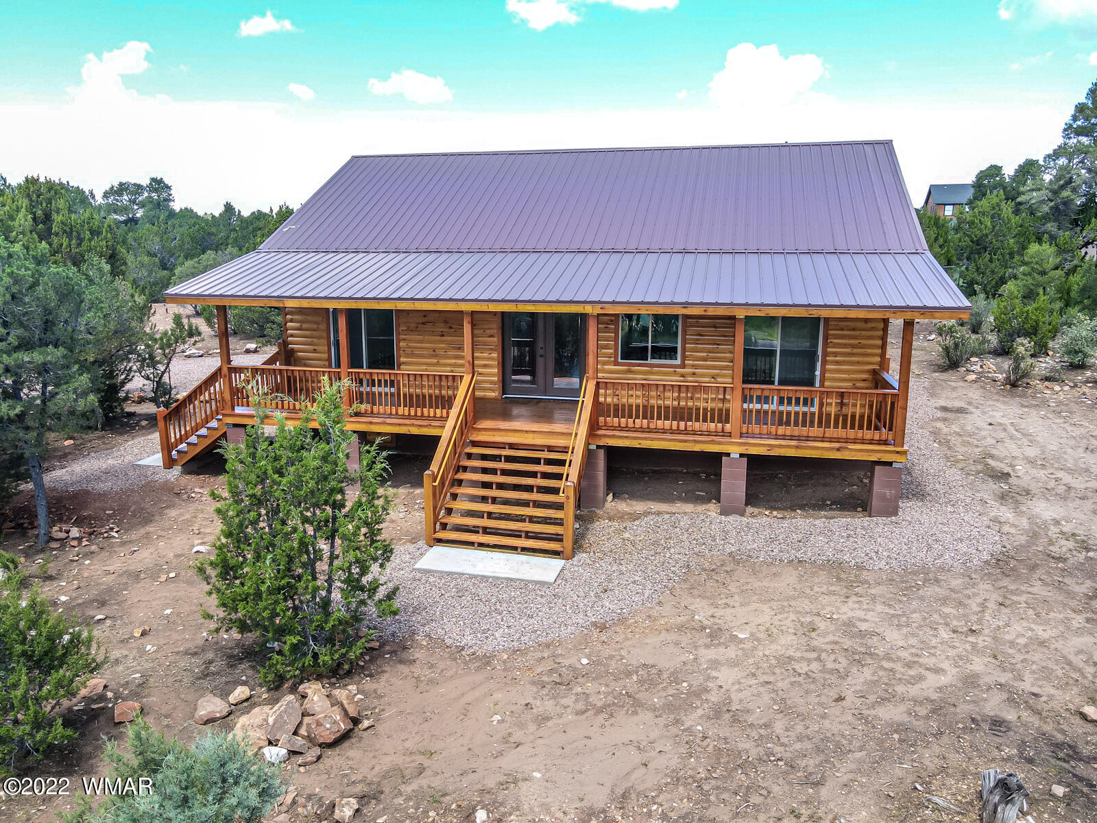 2956 Lodgepole Road Overgaard, AZ 85933 - Photo 1 of 34 a front view of a house with garden