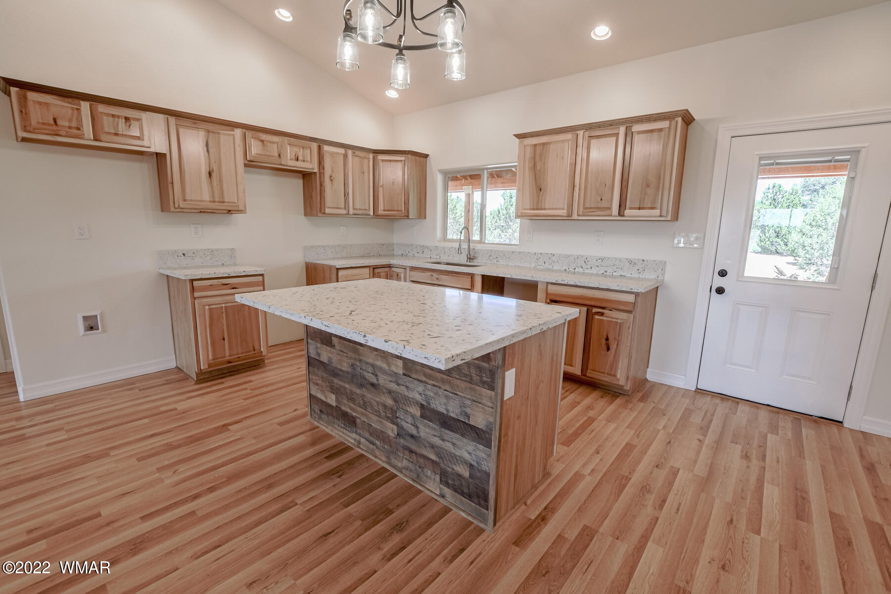 2956 Lodgepole Road Overgaard, AZ 85933 - Photo 11 of 34 a kitchen with stainless steel appliances granite countertop a sink stove and wooden floor