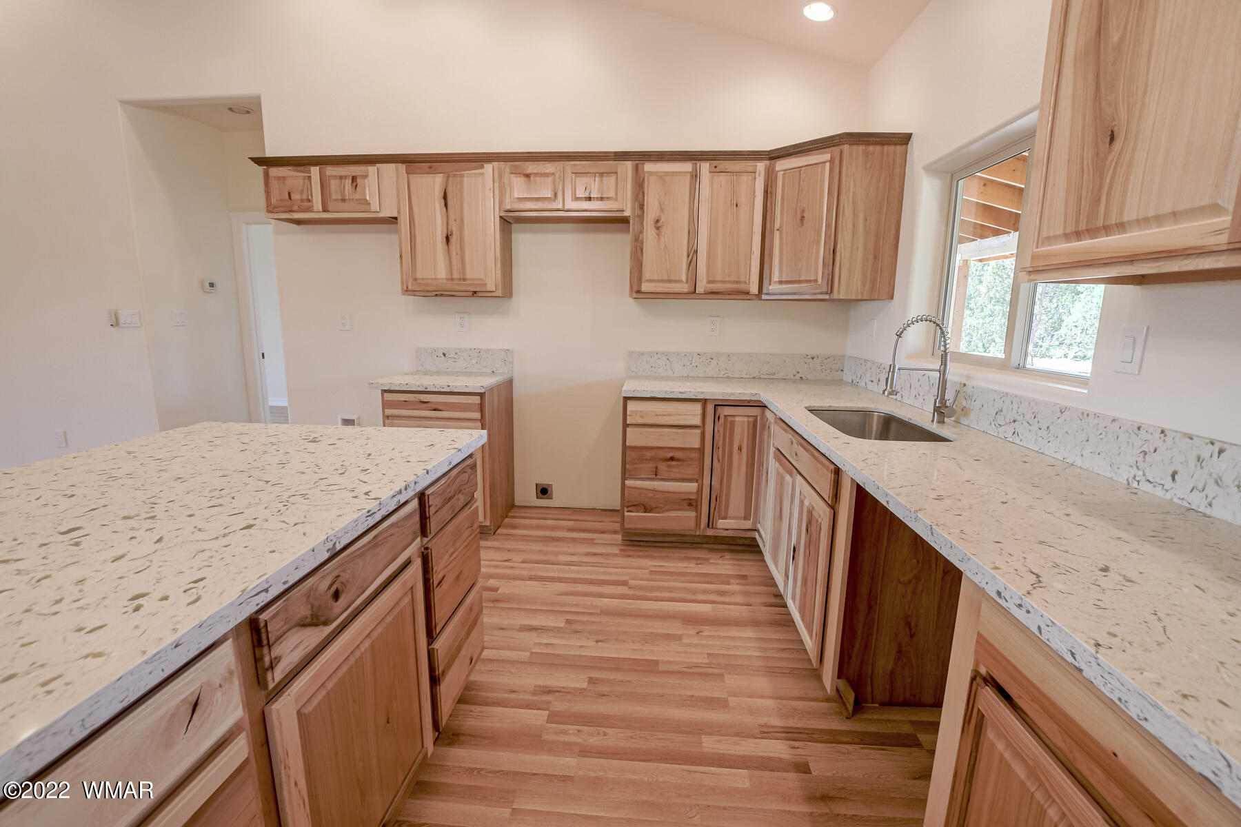 2956 Lodgepole Road Overgaard, AZ 85933 - Photo 12 of 34 a kitchen with sink cabinets and wooden floor