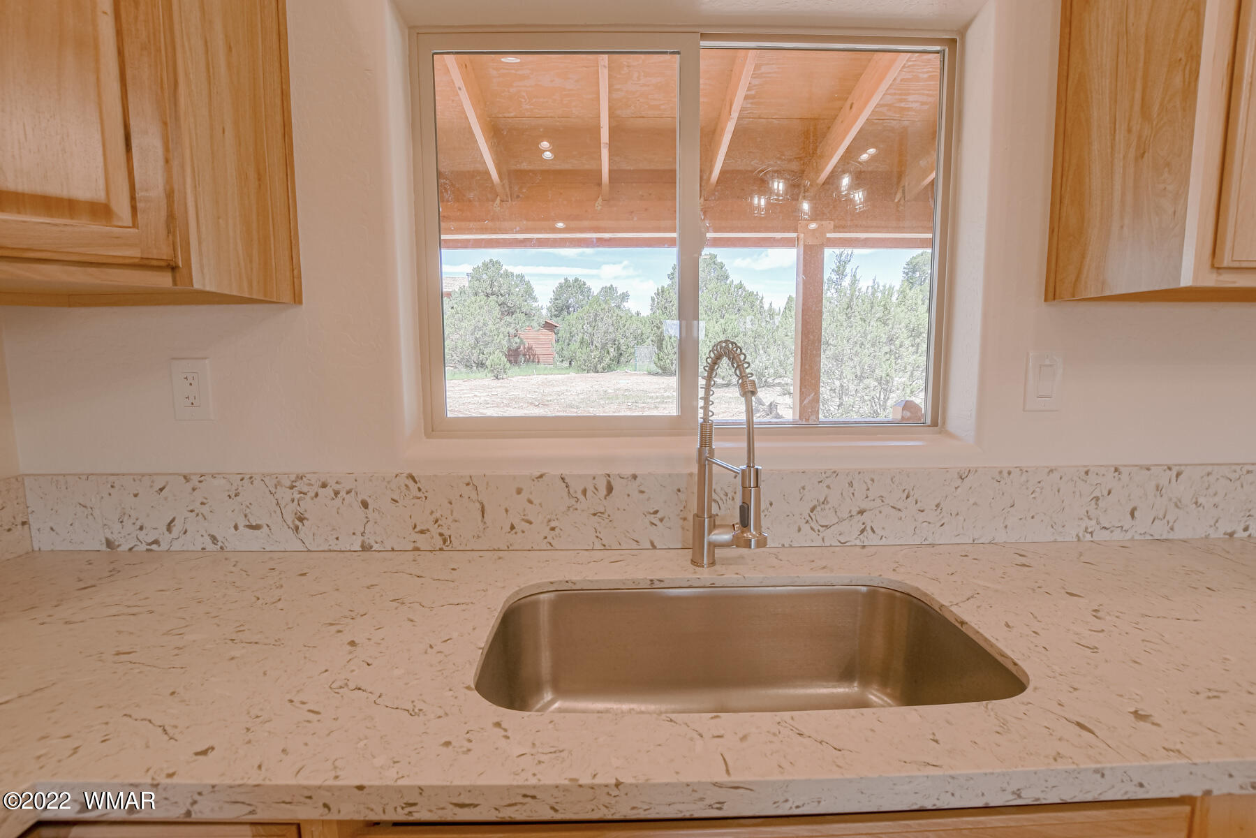 2956 Lodgepole Road Overgaard, AZ 85933 - Photo 13 of 34 a bathroom with a granite countertop sink and window