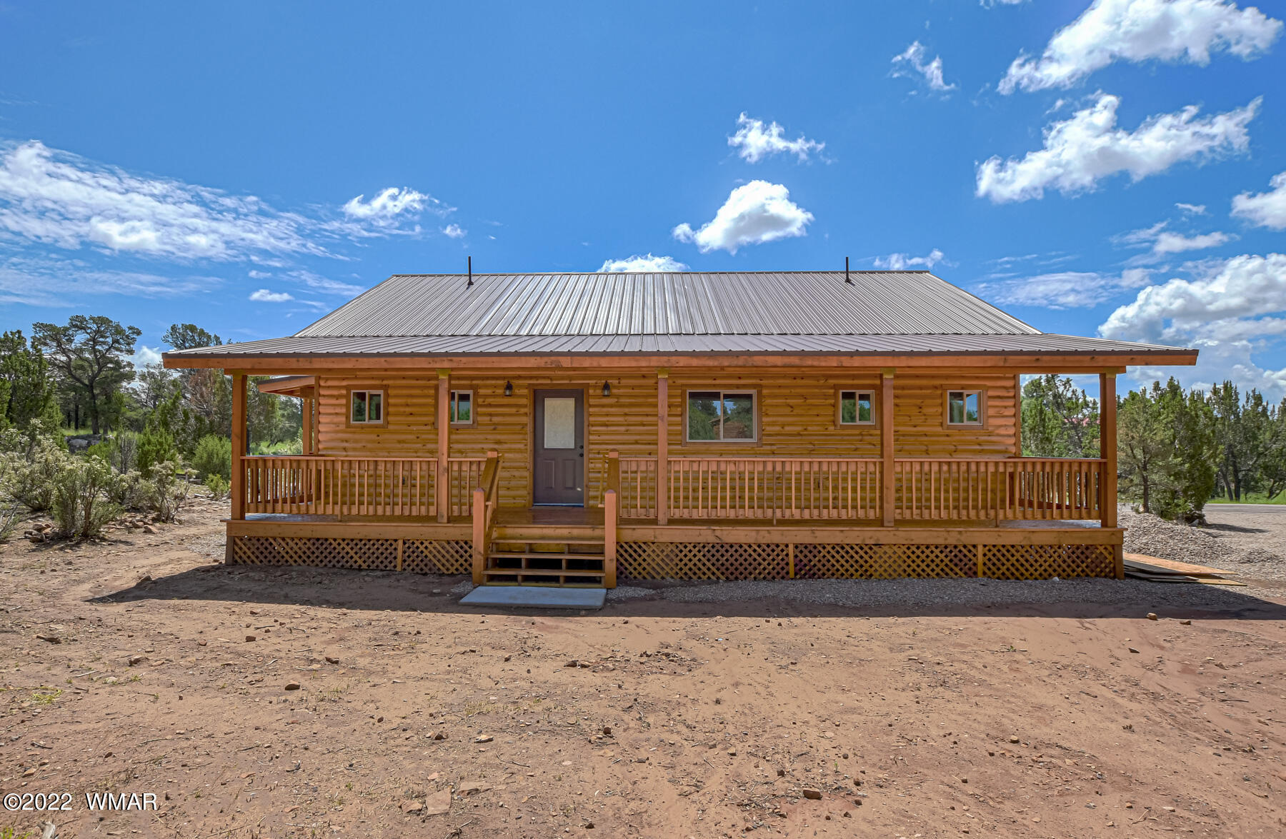 2956 Lodgepole Road Overgaard, AZ 85933 - Photo 33 of 34 a front view of a house with a yard