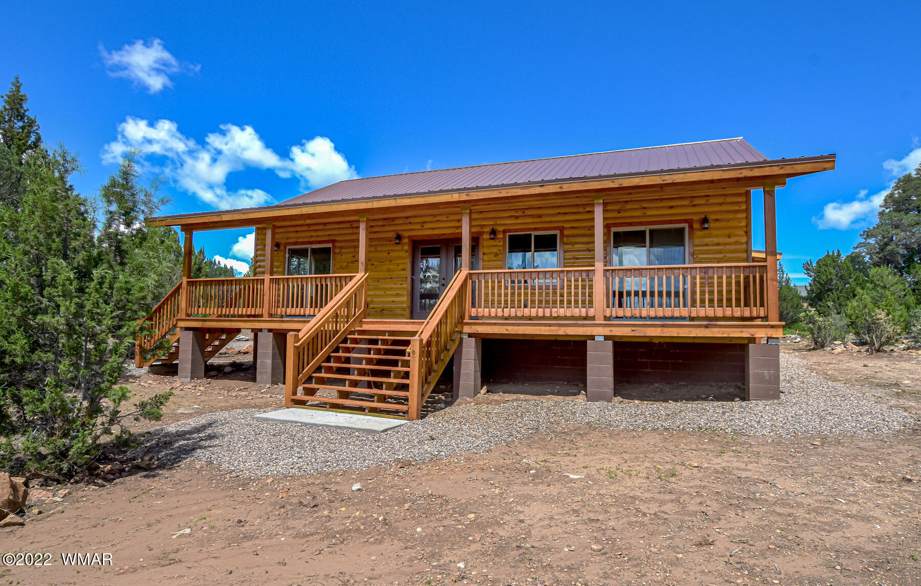 2956 Lodgepole Road Overgaard, AZ 85933 - Photo 34 of 34 a front view of a house with balcony