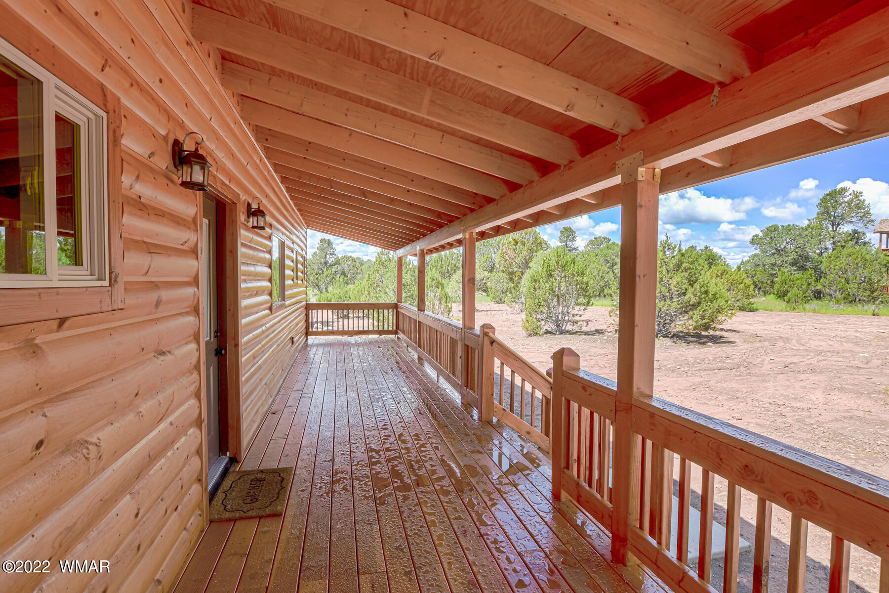 2956 Lodgepole Road Overgaard, AZ 85933 - Photo 8 of 34 a view of a balcony with wooden floor
