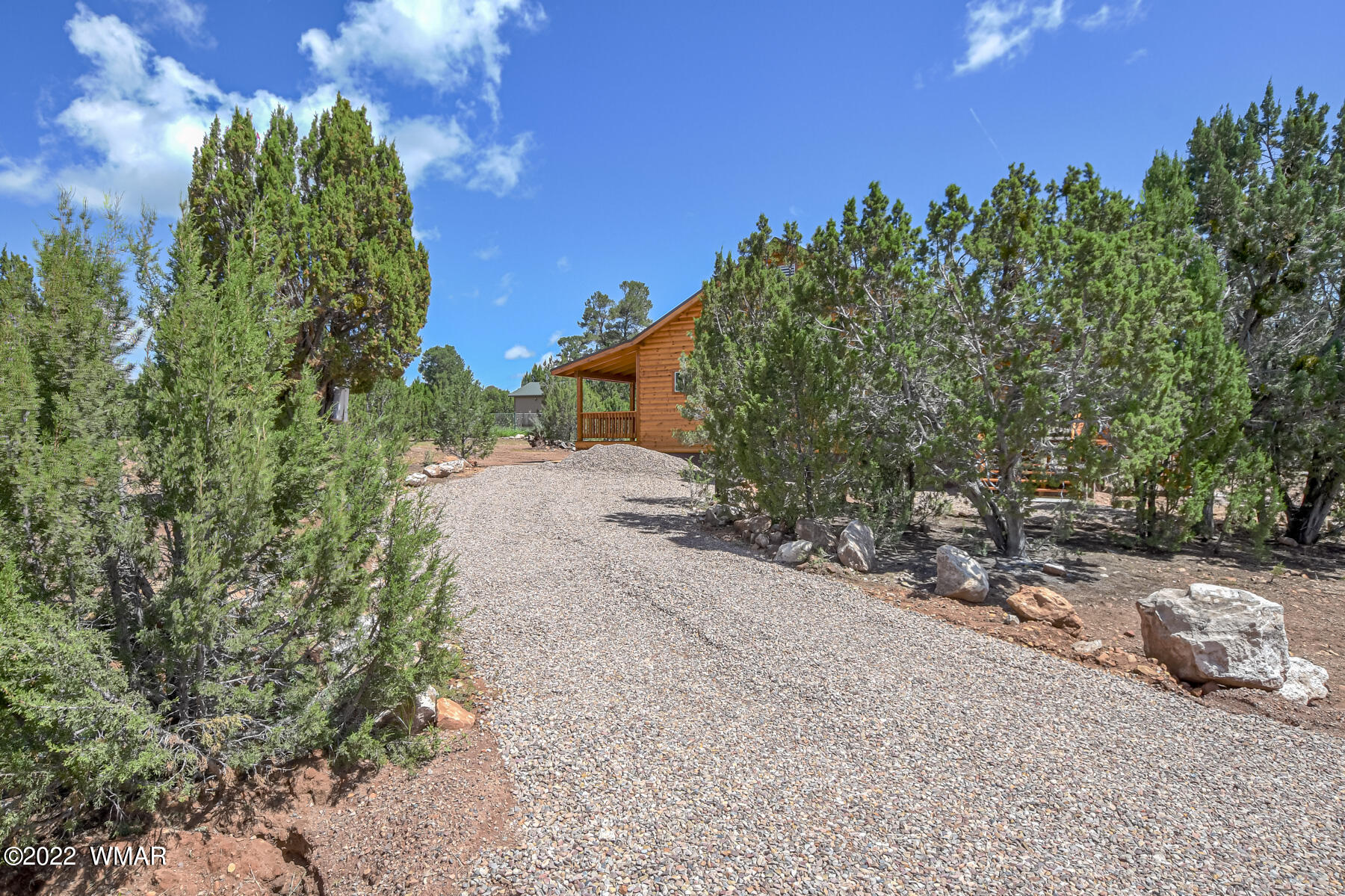 2956 Lodgepole Road Overgaard, AZ 85933 - Photo 10 of 34 a backyard of a house with lots of green space