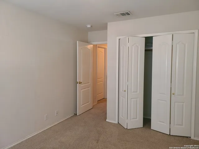 a view of a hallway with closet area