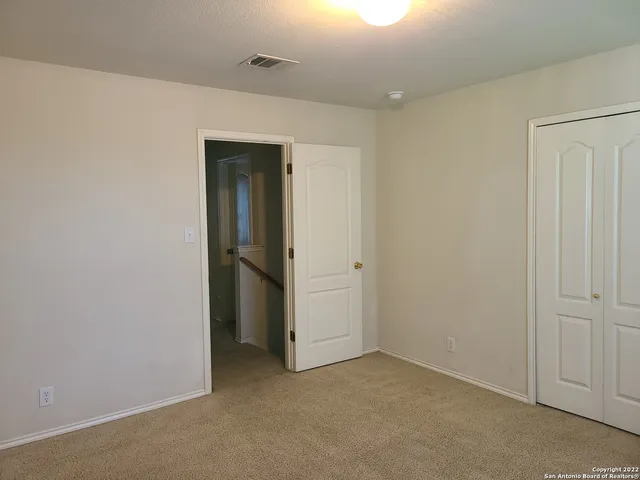 a white toilet sitting next to a bath tub