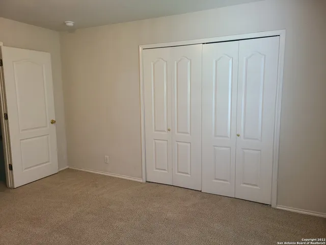 a bathroom with a sink and mirror with toilet