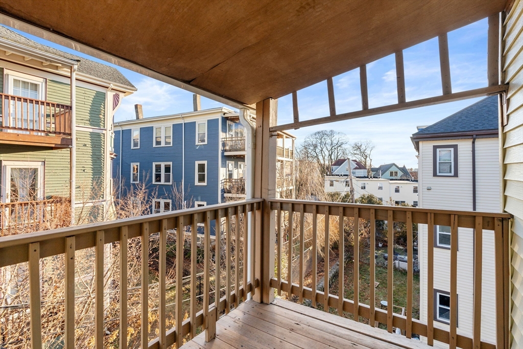 3266 Washington Street, Unit 3F Boston, MA 02130 - Photo 14 of 20 a view of a large building from a balcony
