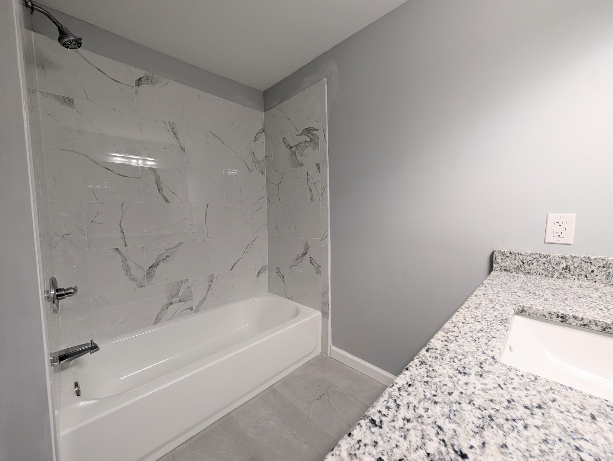 406 Horton Street Decherd, TN 37324 - Photo 18 of 24 a bathroom with a bathtub and a shower