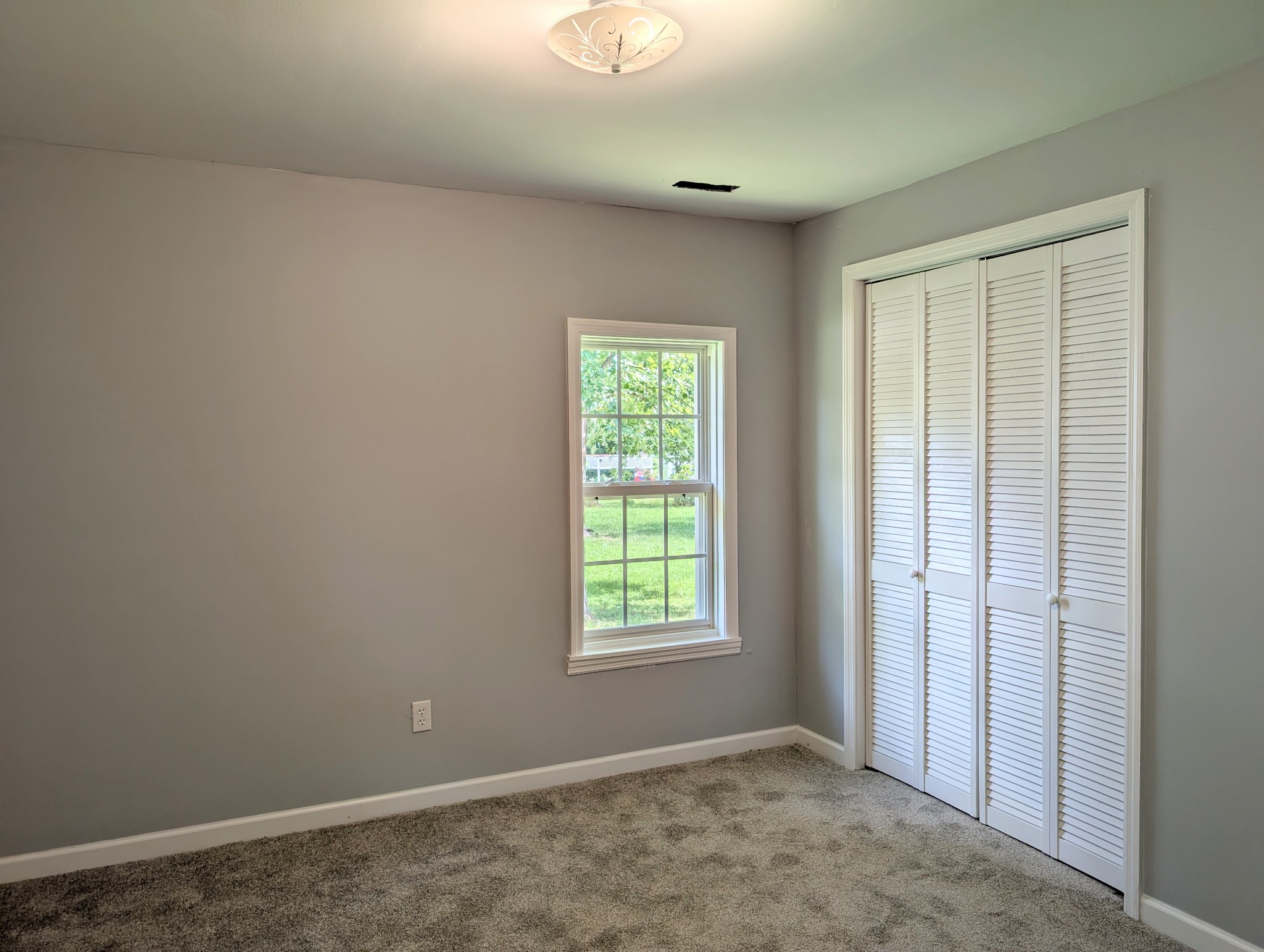 406 Horton Street Decherd, TN 37324 - Photo 21 of 24 an empty room with windows