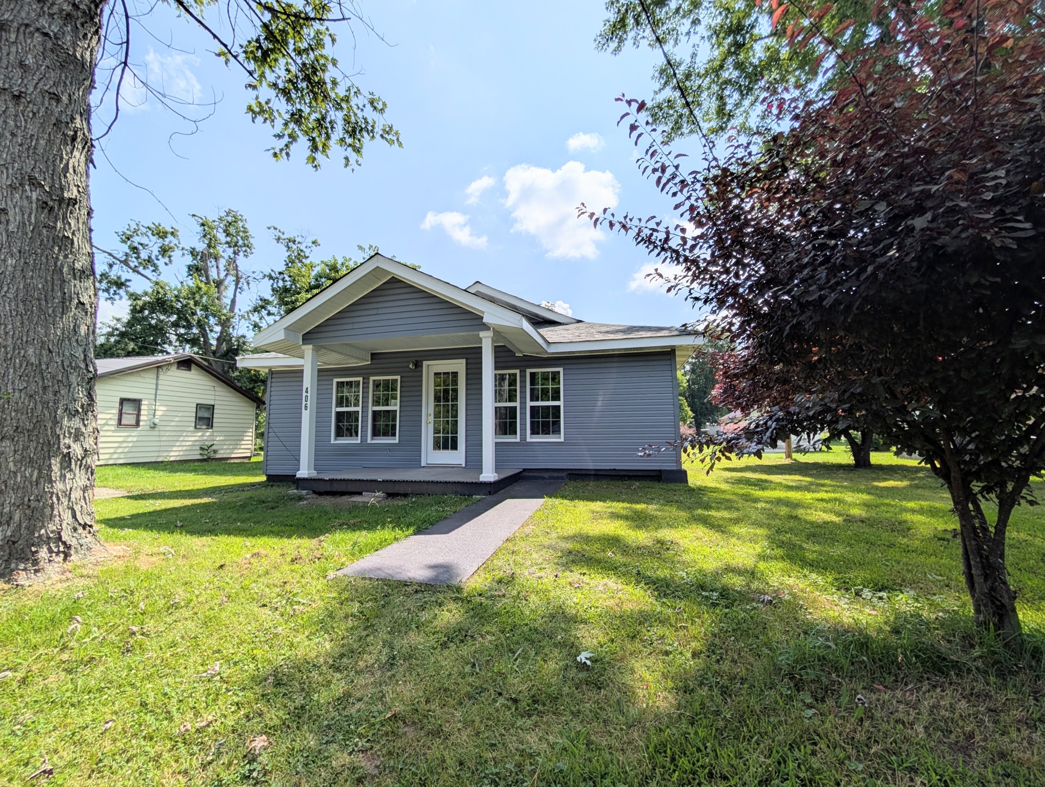 406 Horton Street Decherd, TN 37324 - Photo 3 of 24 a view of a house with a yard