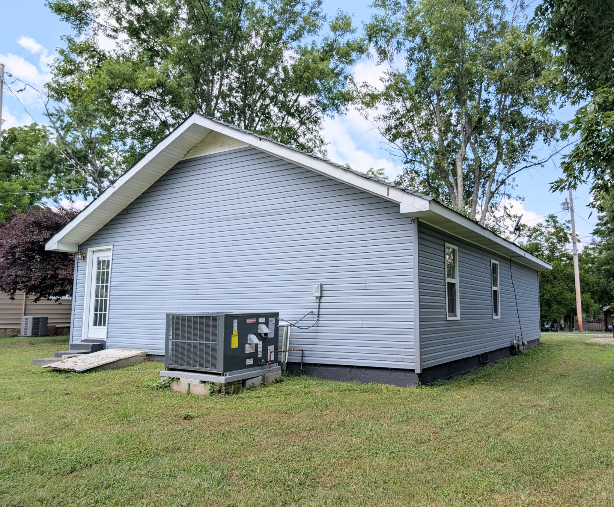 406 Horton Street Decherd, TN 37324 - Photo 8 of 24 a view of a house with a backyard