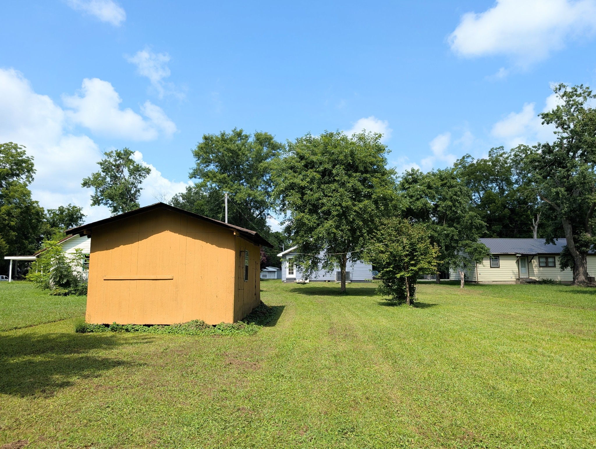 406 Horton Street Decherd, TN 37324 - Photo 9 of 24 a view of an house with backyard space and garden