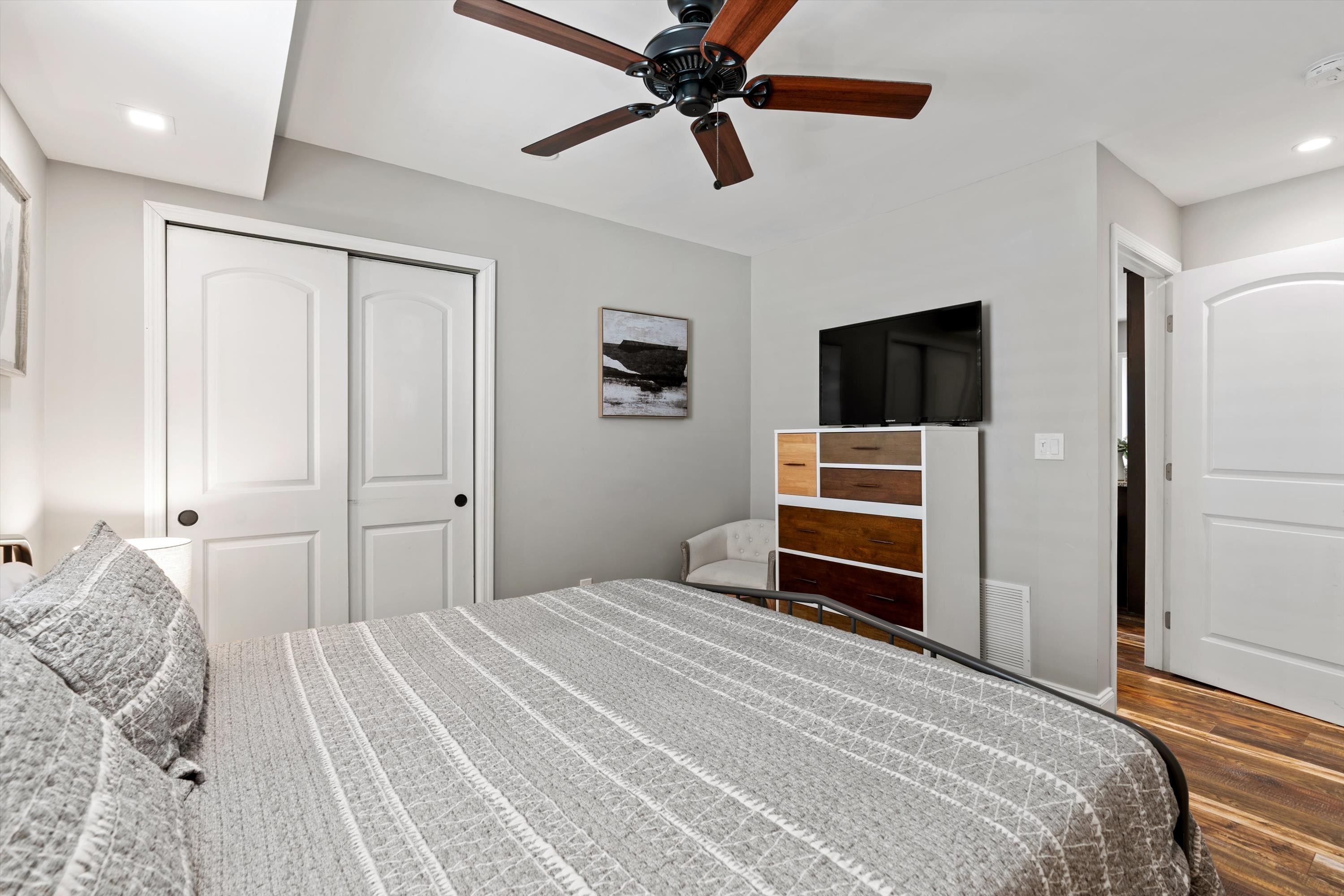 9 3rd Street St. Augustine, FL 32080 - Photo 12 of 25 a bedroom with a bed and a flat screen tv