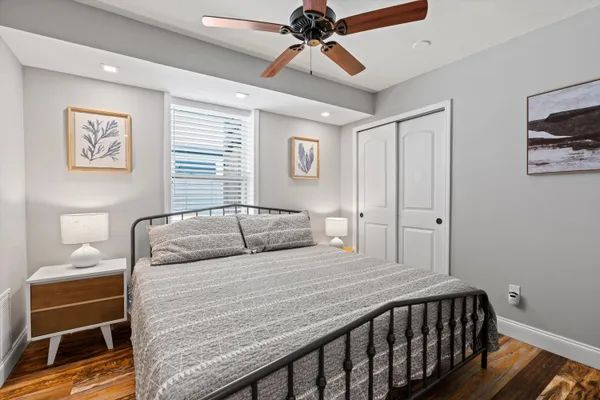 a bedroom with a bed and a lamp