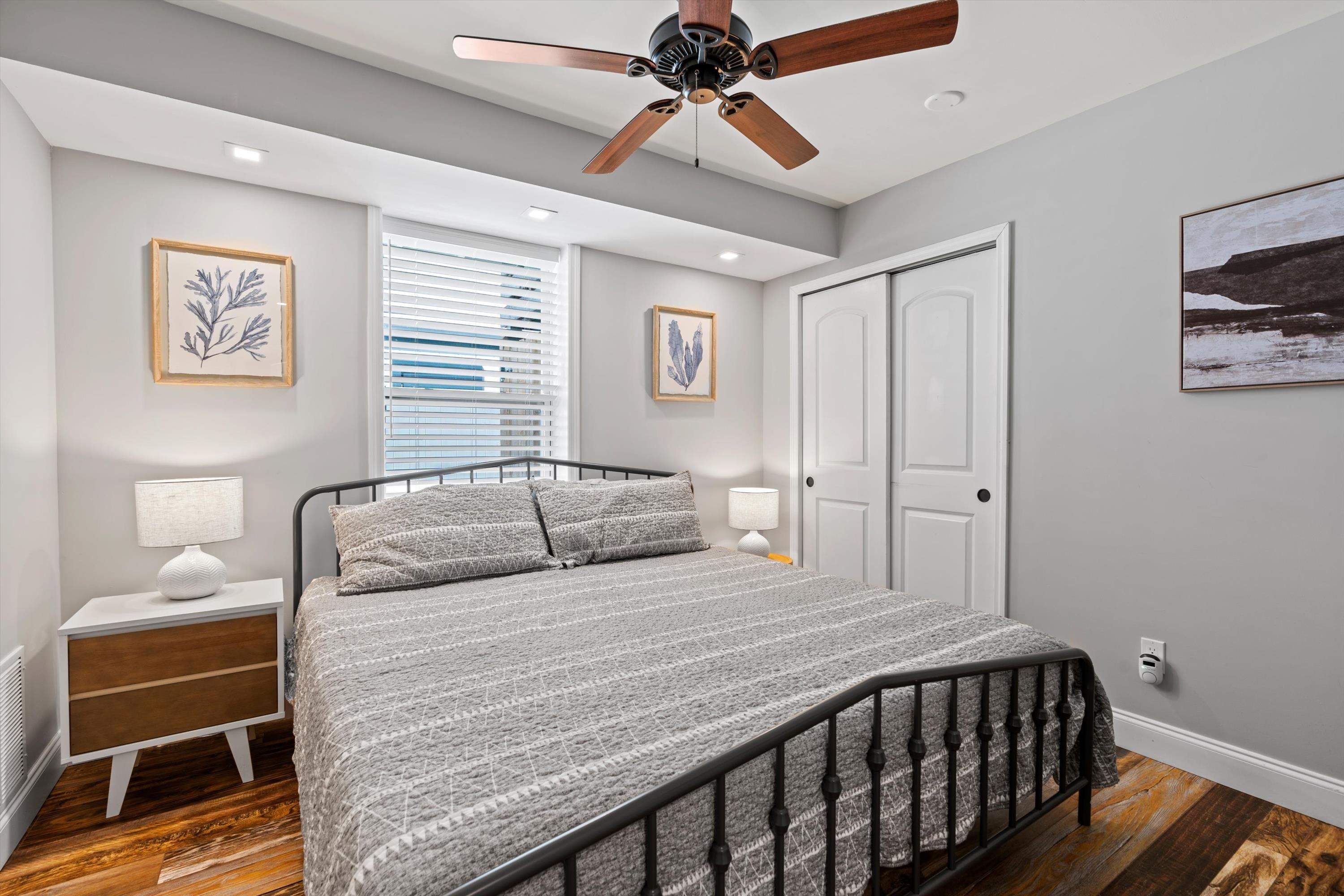 9 3rd Street St. Augustine, FL 32080 - Photo 13 of 25 a bedroom with a bed and a lamp