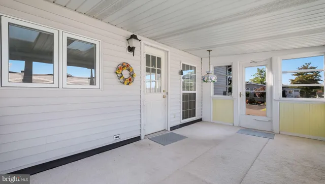 a living room with furniture a rug and a window