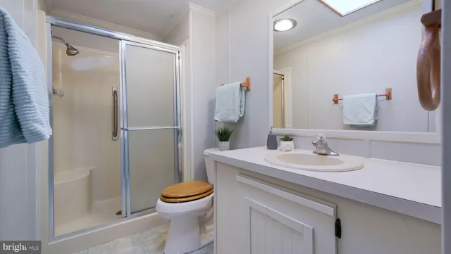 an empty room with windows and view of an entryway