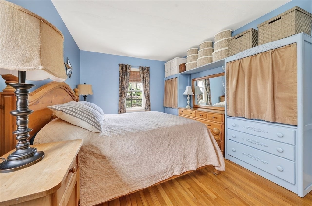 15 Leigh Road Norwell, MA 02061 - Photo 17 of 34 a bed sitting in a bedroom next to a window