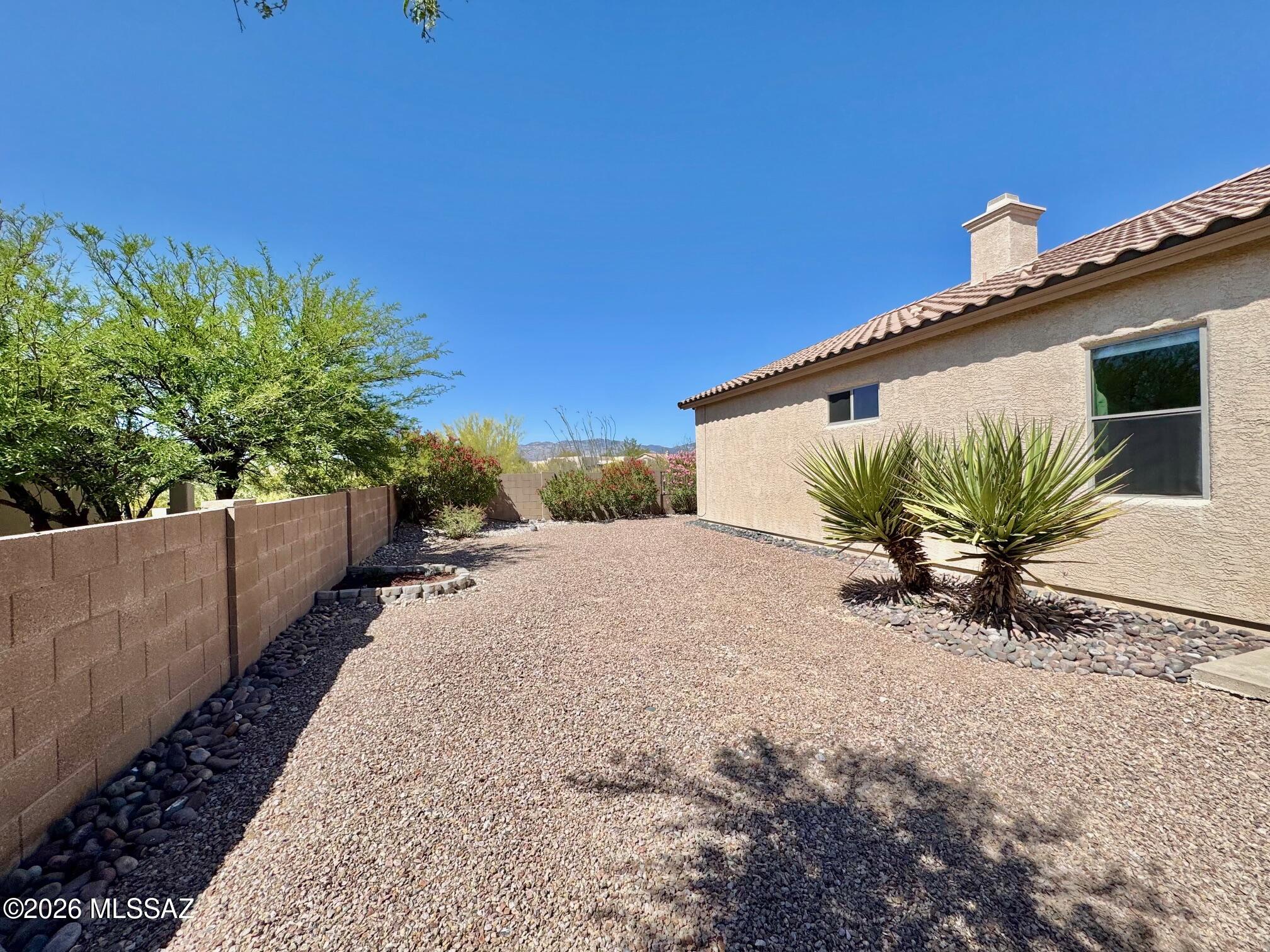 10835 South Heart Break Ridge Place Vail, AZ 85641 - Photo 43 of 49 a view of a back yard of the house