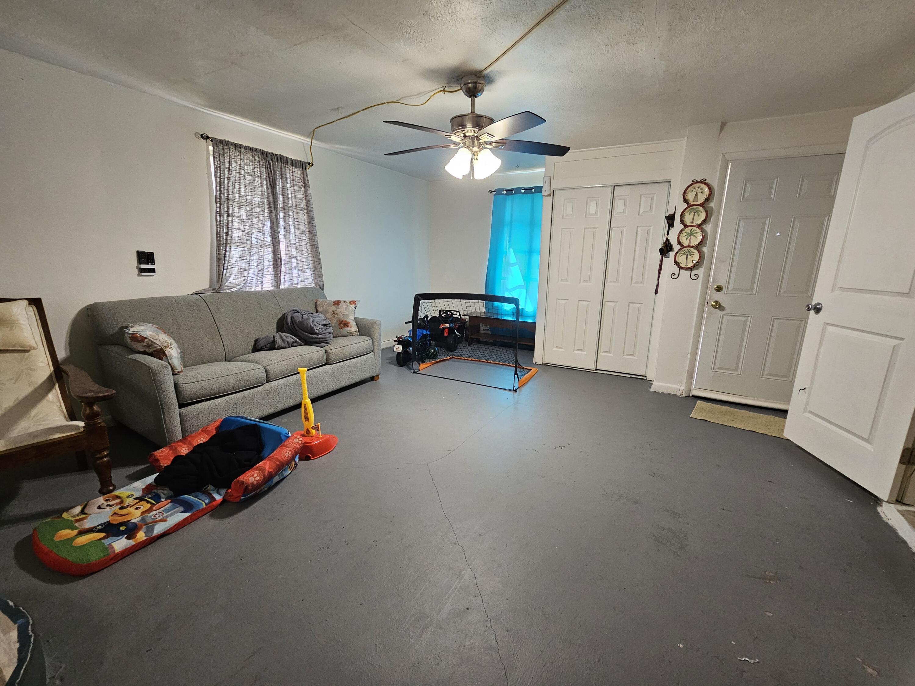 908 66th Street Marathon, FL 33050 - Photo 12 of 31 a living room with furniture and a chandelier