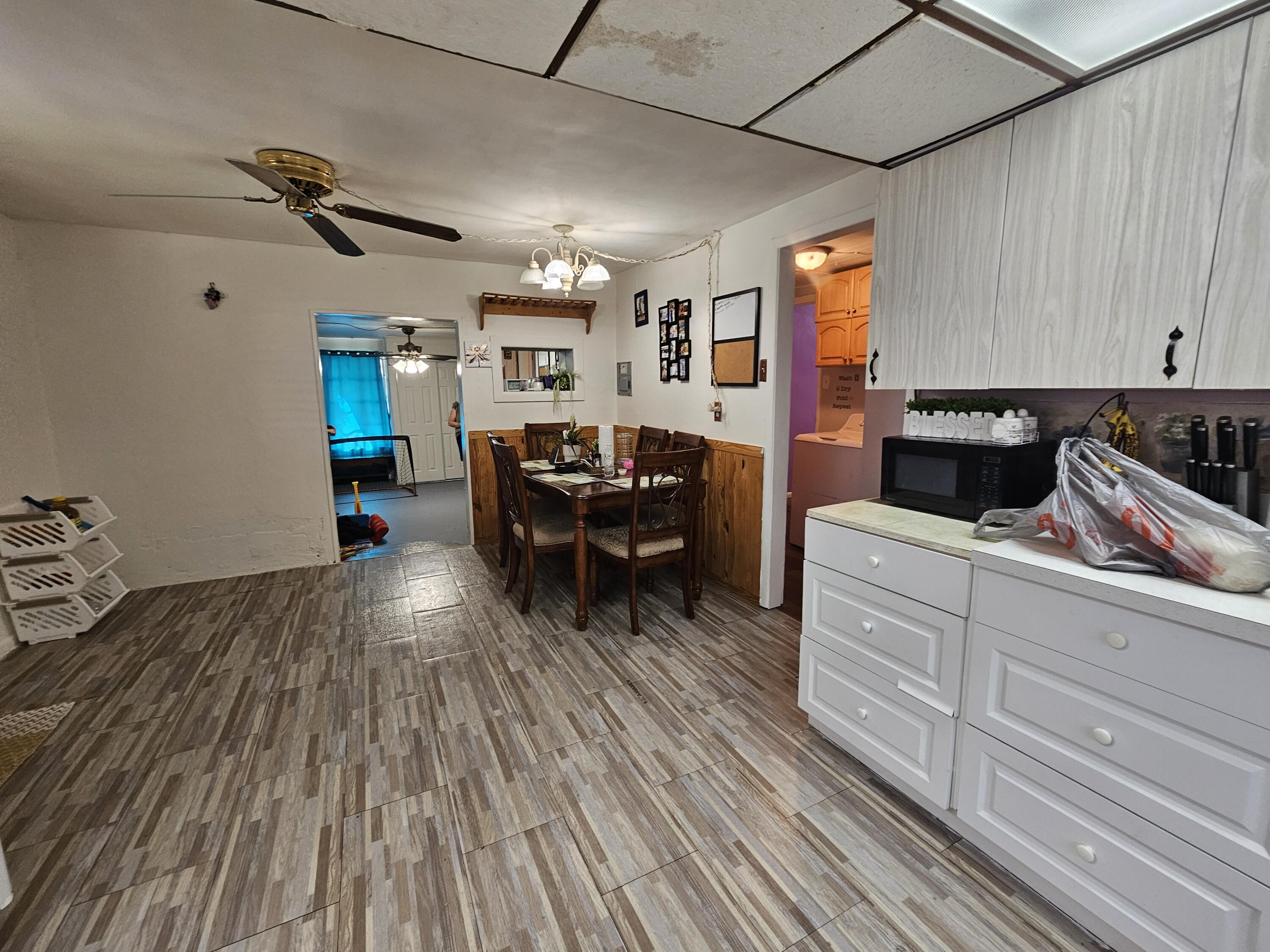 908 66th Street Marathon, FL 33050 - Photo 16 of 31 a kitchen with sink cabinets and wooden floor