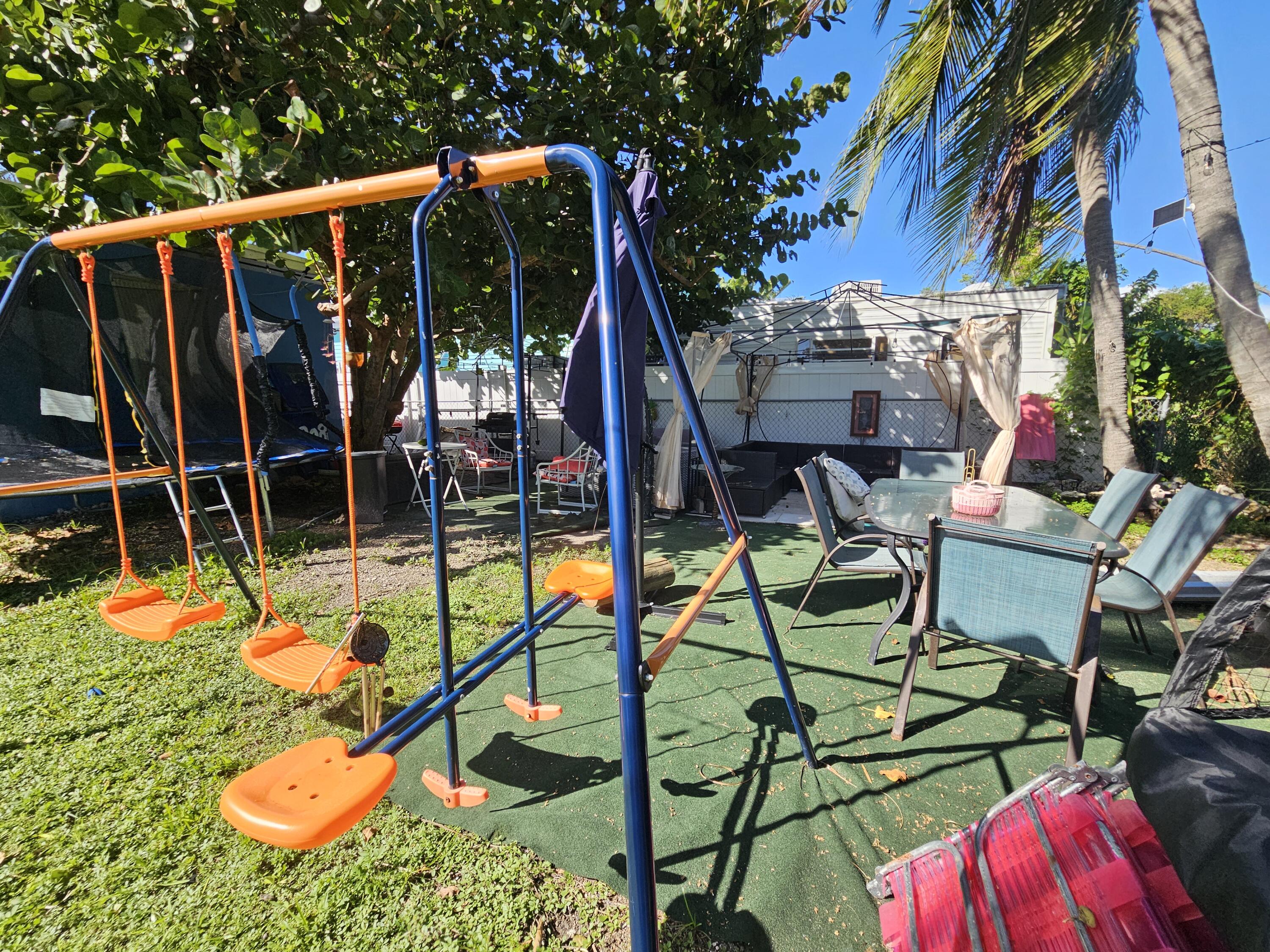 908 66th Street Marathon, FL 33050 - Photo 26 of 31 a view of swimming pool with outdoor seating