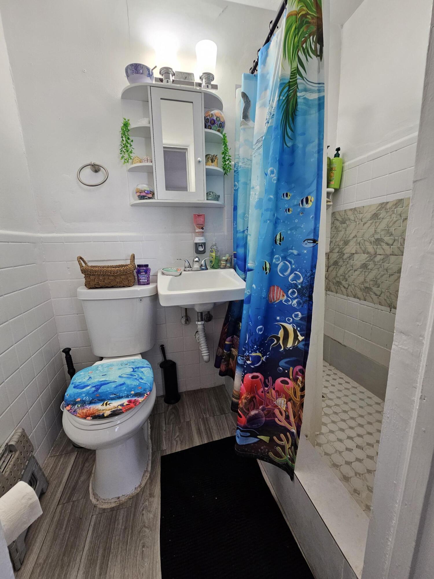 908 66th Street Marathon, FL 33050 - Photo 5 of 31 a bathroom with a sink toilet and shower