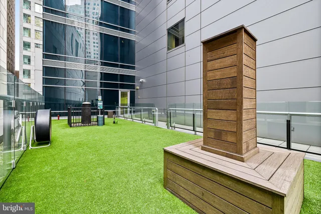 a balcony with furniture and a potted plant