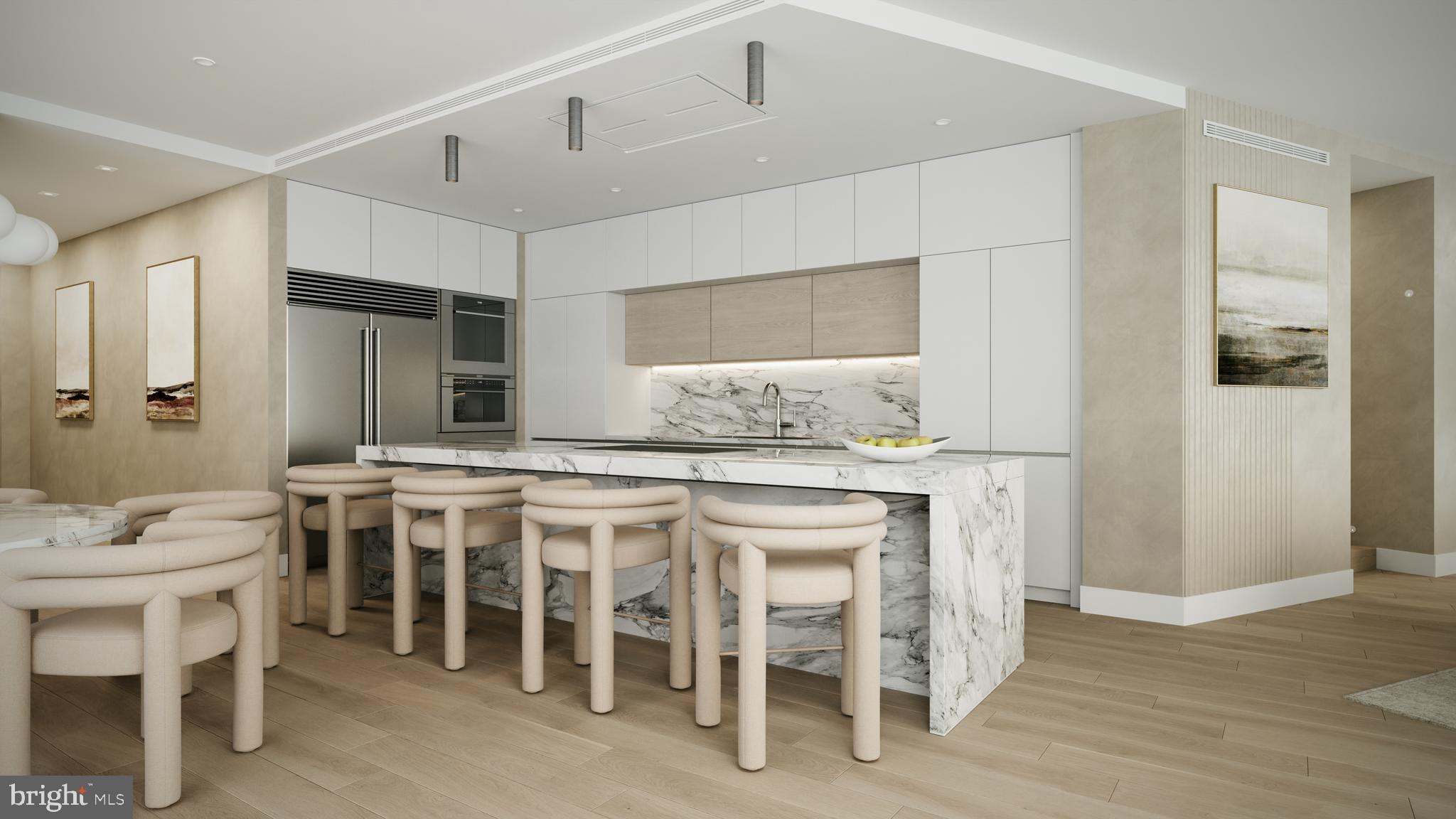 1414 South Penn Square, Unit PH1A Philadelphia, PA 19102 - Photo 3 of 20 a kitchen with a sink and chairs