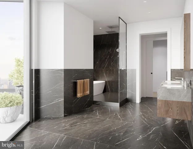 a living room with furniture gym equipment and large windows