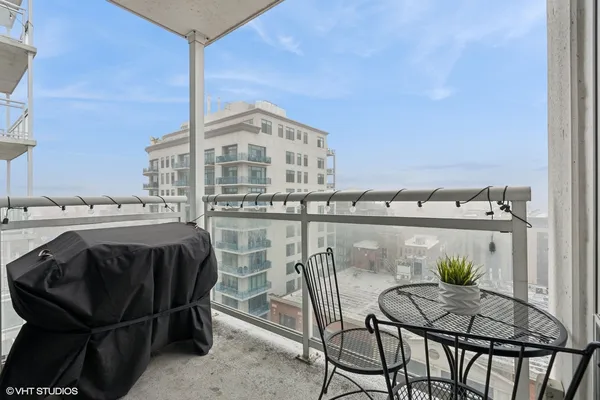 a view of a chairs and table in patio
