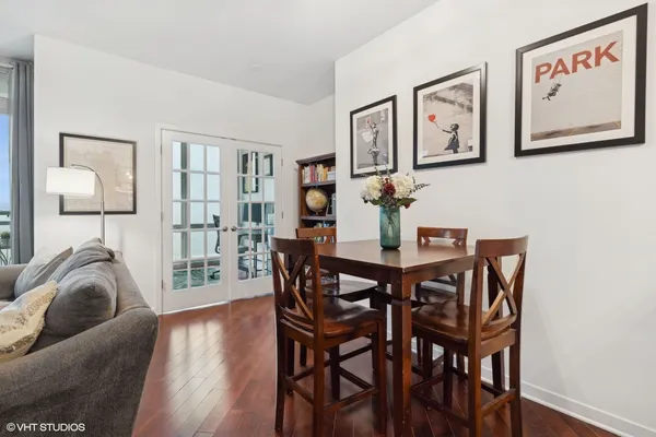 a view of a dining room with furniture and wooden floor
