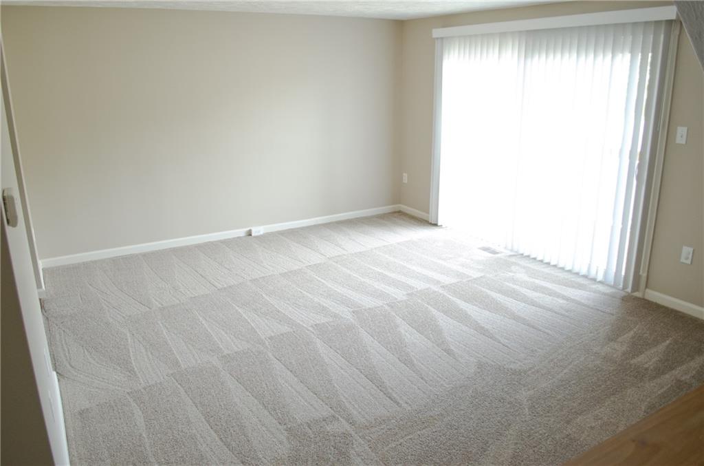 2005 Clearfork Road Bridgeville, PA 15017 - Photo 4 of 25 Brand new carpet and fresh paint allow are shown off by the abundant amount of natural sunlight from the sliding glass door.