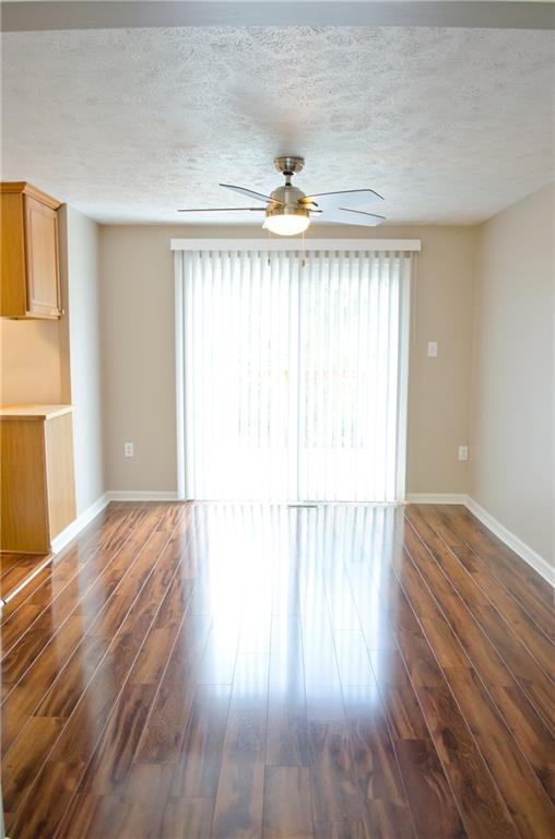 2005 Clearfork Road Bridgeville, PA 15017 - Photo 7 of 25 Beautiful updated plank flooring gives the dining room a beautiful atmosphere.