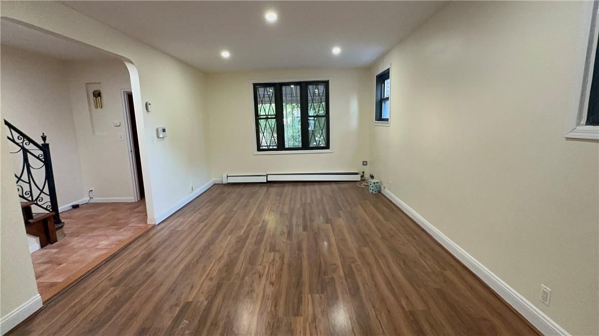 2001 Paulding Avenue, Unit 2F Bronx, NY 10462 - Photo 1 of 1 wooden floor in an empty room with a window