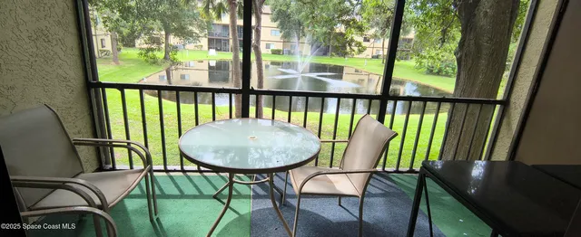 an empty room with windows and entrance