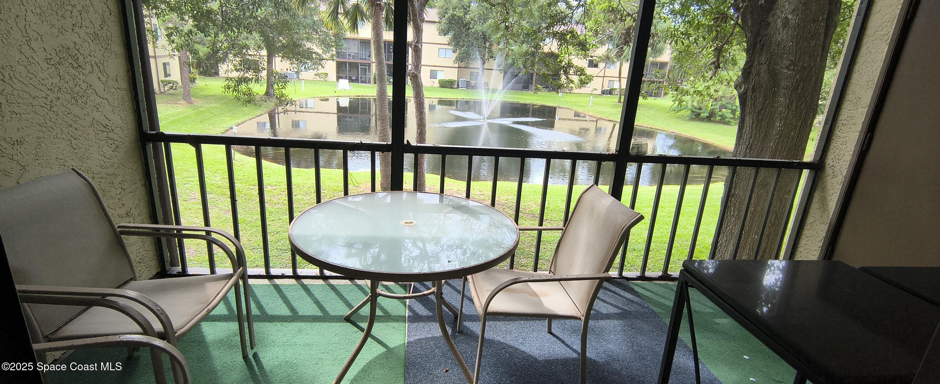 7801 Maplewood Drive, Unit 911 Melbourne, FL 32904 - Photo 7 of 16 a view of a dining room with furniture window and outside view