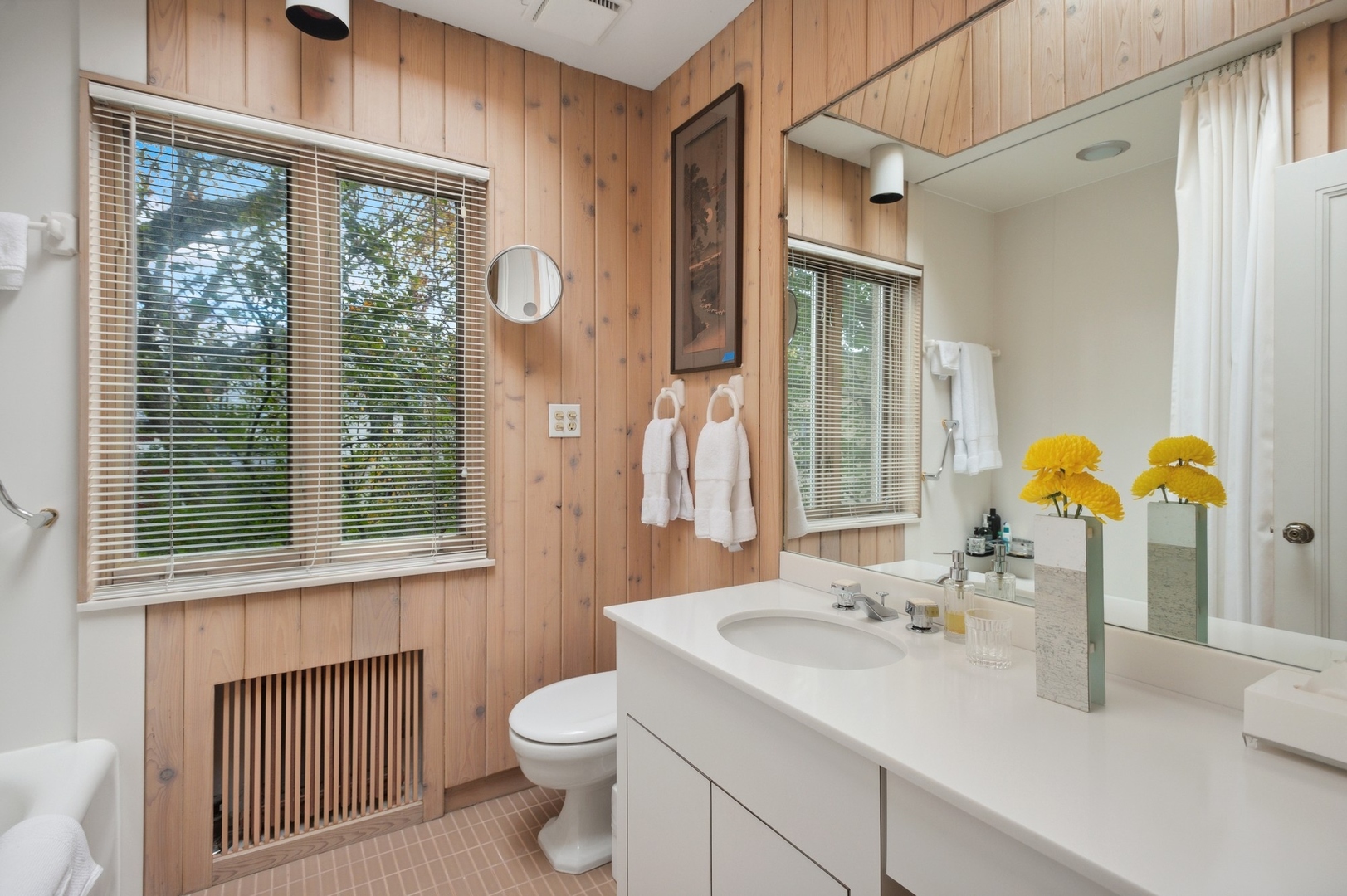 228 Sheridan Road Winnetka, IL 60093 - Photo 23 of 32 a bathroom with a sink a toilet and a mirror