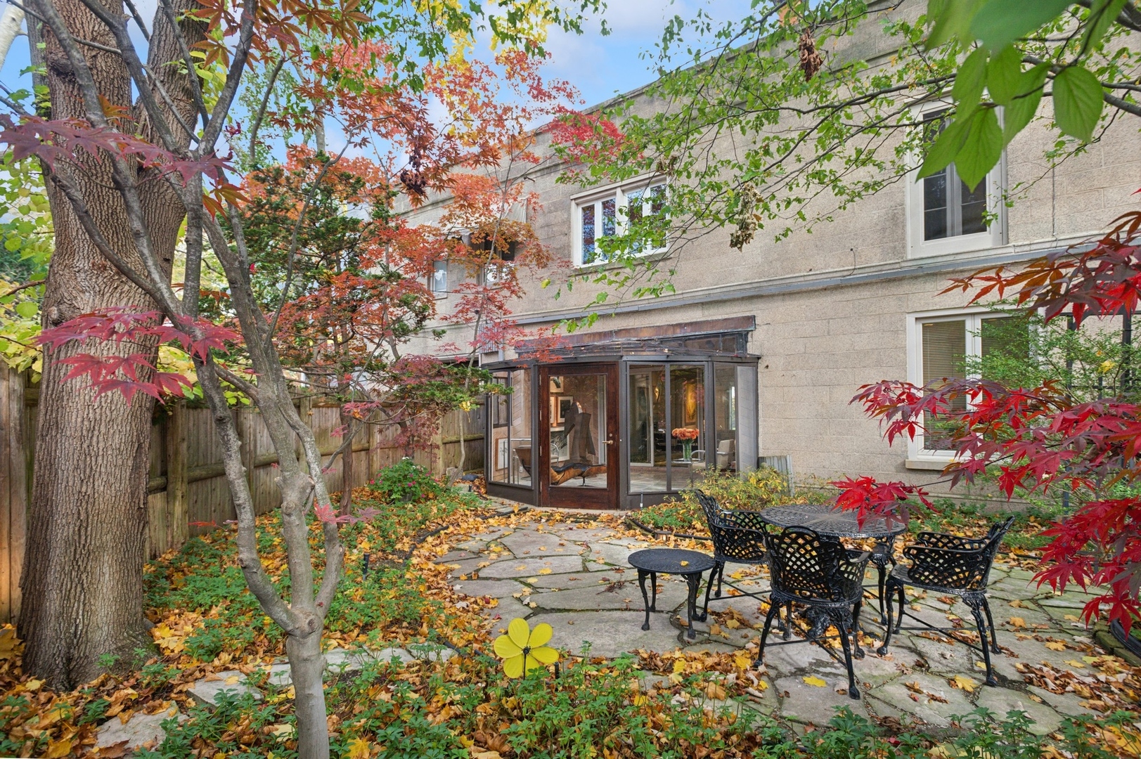 228 Sheridan Road Winnetka, IL 60093 - Photo 29 of 32 a view of a chairs and table in a backyard
