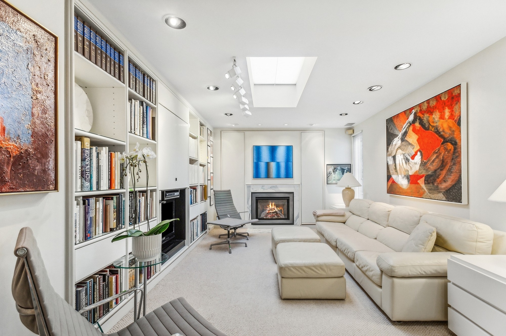 228 Sheridan Road Winnetka, IL 60093 - Photo 3 of 32 a living room with furniture a fireplace and a flat screen tv