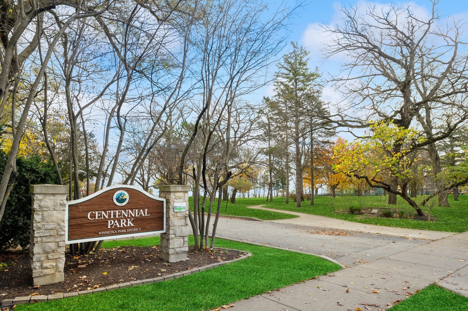 228 Sheridan Road Winnetka, IL 60093 - Photo 32 of 32 a sign board with a tree in the park