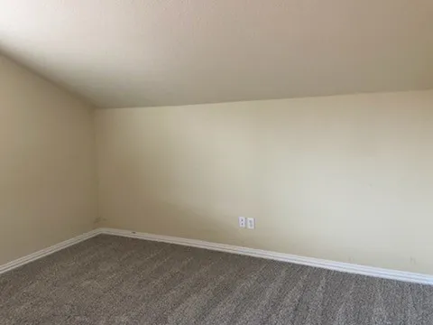 a view of a room that has a window in it