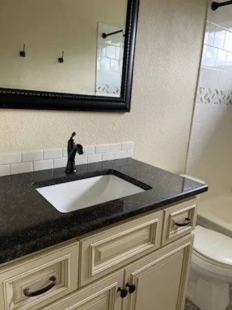 a bathroom with a bathtub and shower